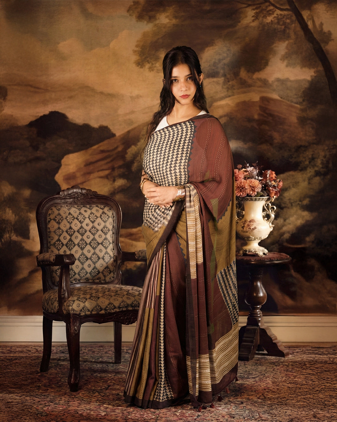 Sophisticated studio view of the Olive and Rust Silk Georgette Saree showcasing a modern ethnic aesthetic.