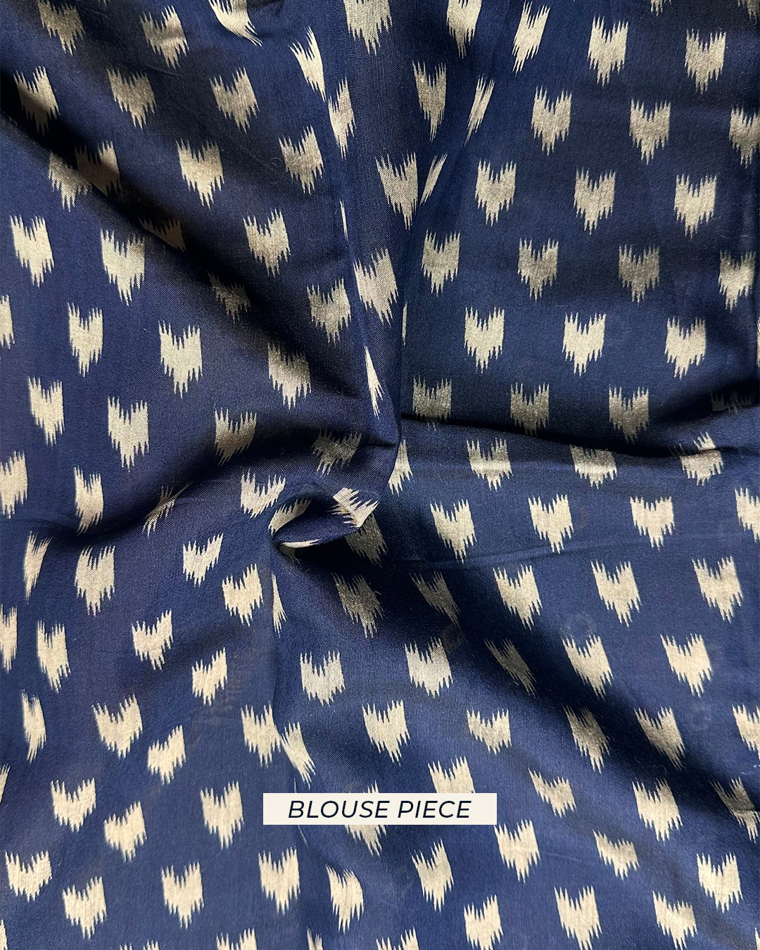 Dark blue unstitched blouse piece with heart-shaped motifs for the Rajathee Saree Ivory and Blue Bandhani collection.
