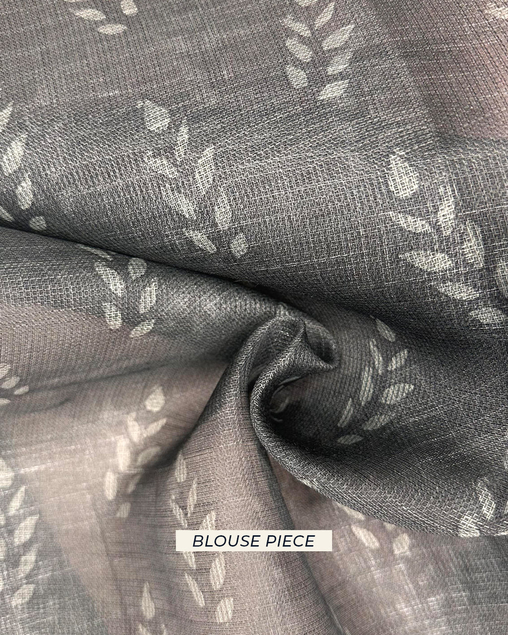 Matching blouse piece fabric with leaf motifs for the Rajathee Saree Black and Pink Peacock-inspired collection.