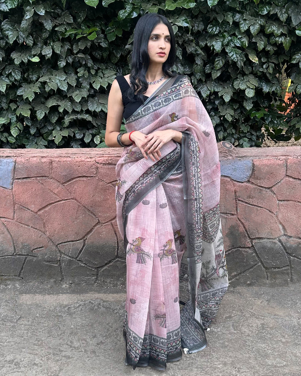 Rajathee Saree Black and Pink Cotton Super Net Saree with peacock-inspired print and sheer, breathable texture.