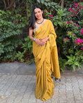 Rajathee Saree Mustard Yellow Mul Cotton Saree featuring a plain, minimalist design and ultra-lightweight drape.