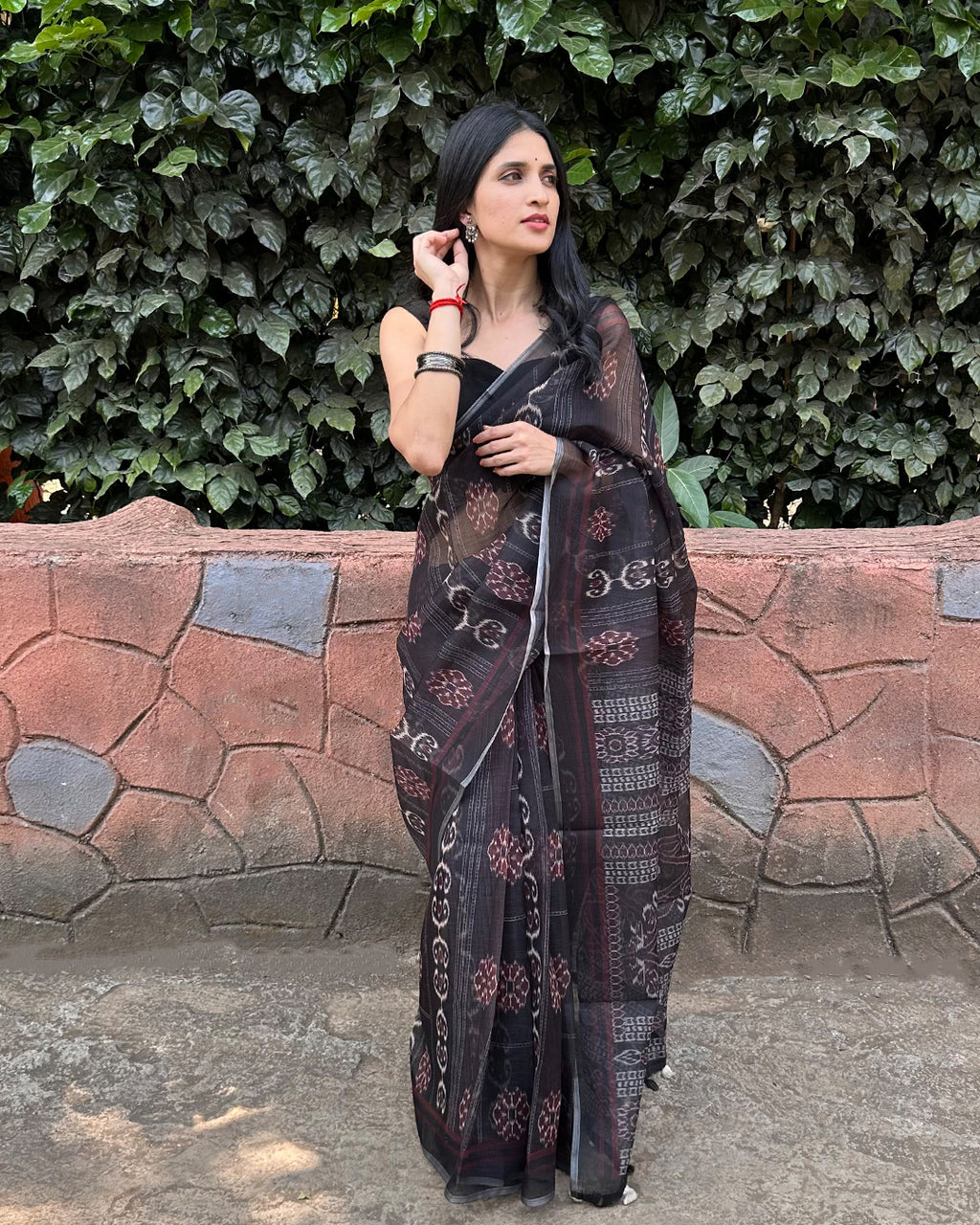 Rajathee Saree Black Cotton Super Net Saree featuring Patola-inspired geometric print and sheer lightweight fabric.