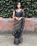 Rajathee Saree Black Cotton Super Net Saree featuring traditional peacock print motifs and earthy accents.
