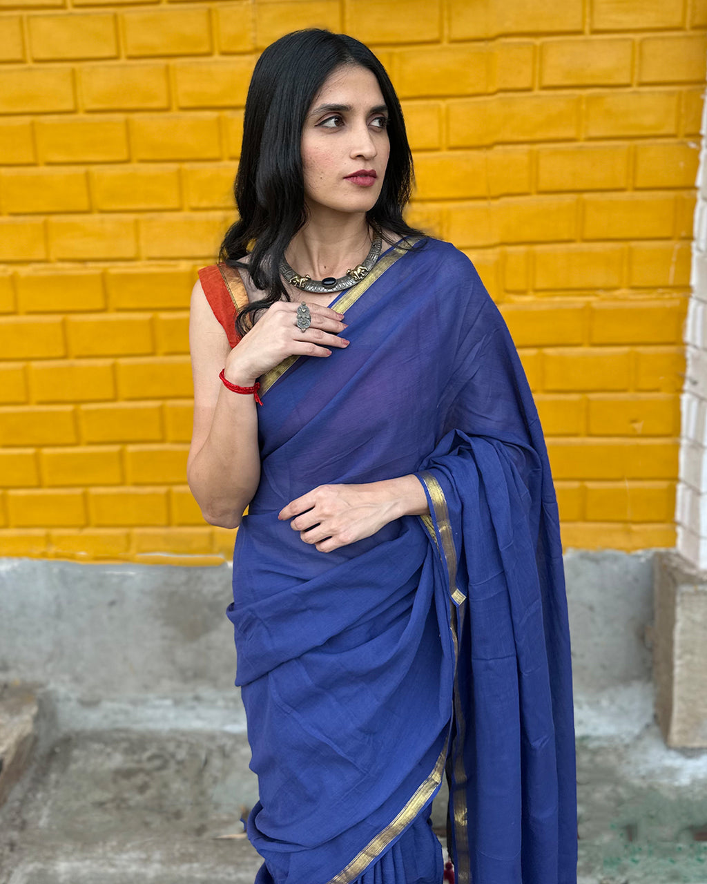 Close-up portrait of the Deep Blue Mul Cotton Saree by Rajathee Saree showing the soft, breathable texture.