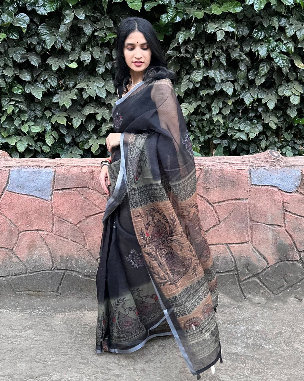Fluid and breathable Black Cotton Super Net Saree by Rajathee Saree with traditional earthy-toned prints.