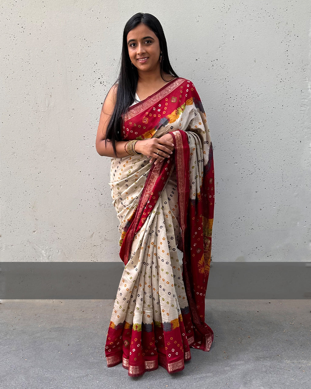 Rajathee Saree Red and Ivory Cambric Silk Saree with festive Bandhani print motifs and a subtle sheen.