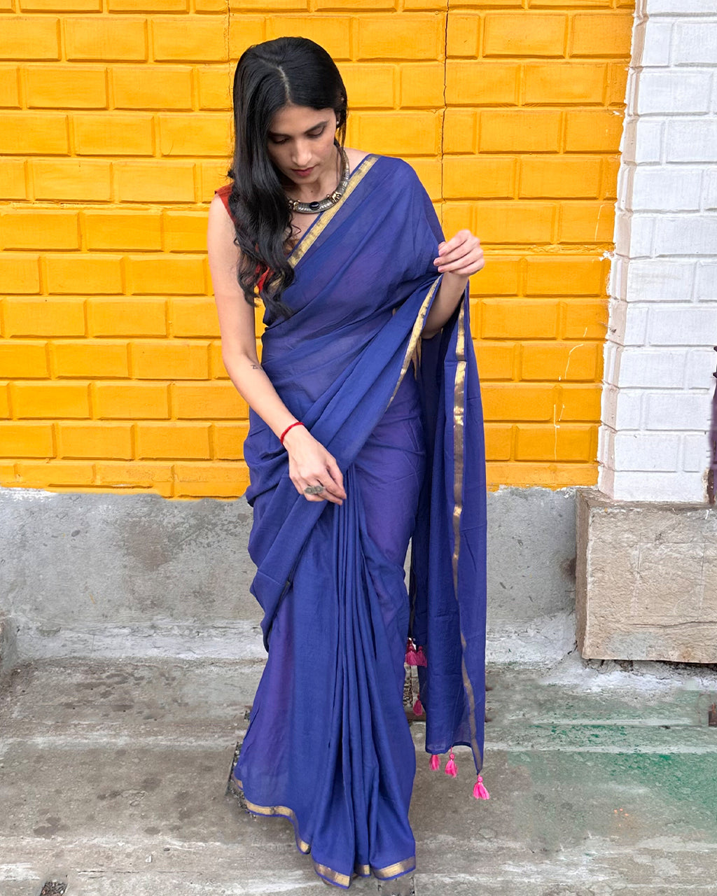 Full length view of the smooth, fluid drape of the Deep Blue Mul Cotton Saree with elegant gold accents.