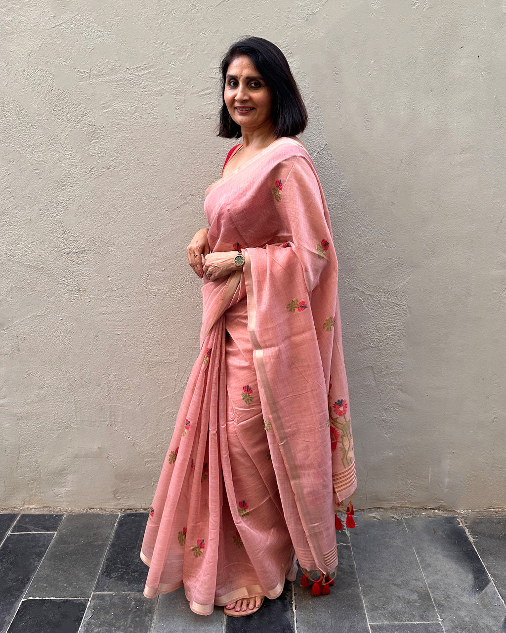Elegant side view of the Blush Pink Tussar Silk Saree by Rajathee Saree showing its structured, graceful drape.