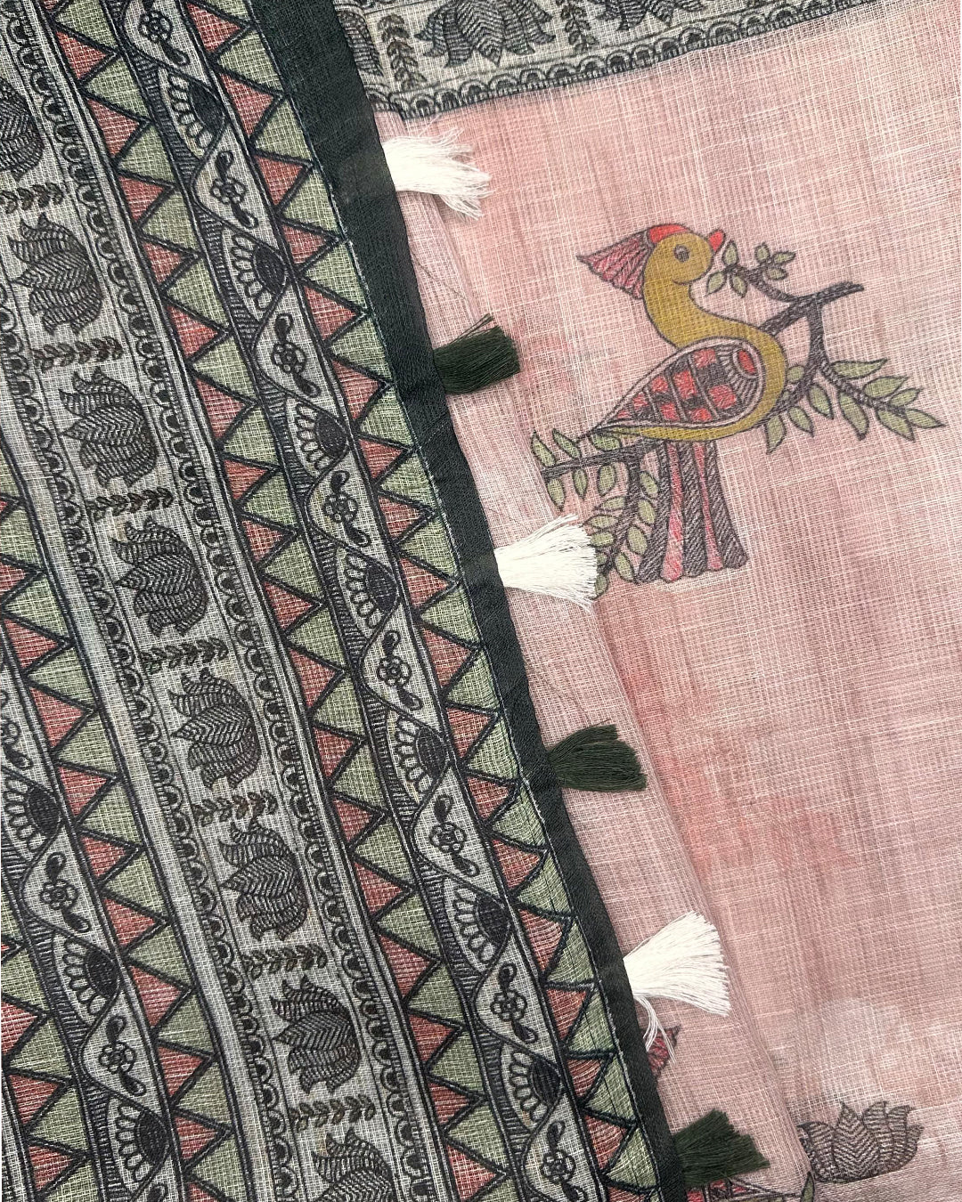 Close-up of the peacock motif, border detailing, and tassels on the Black and Pink Cotton Super Net Saree by Rajathee Saree.