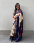 Rajathee Saree Ivory and Blue Cambric Silk Saree featuring a traditional Bandhani print and soft sheen.