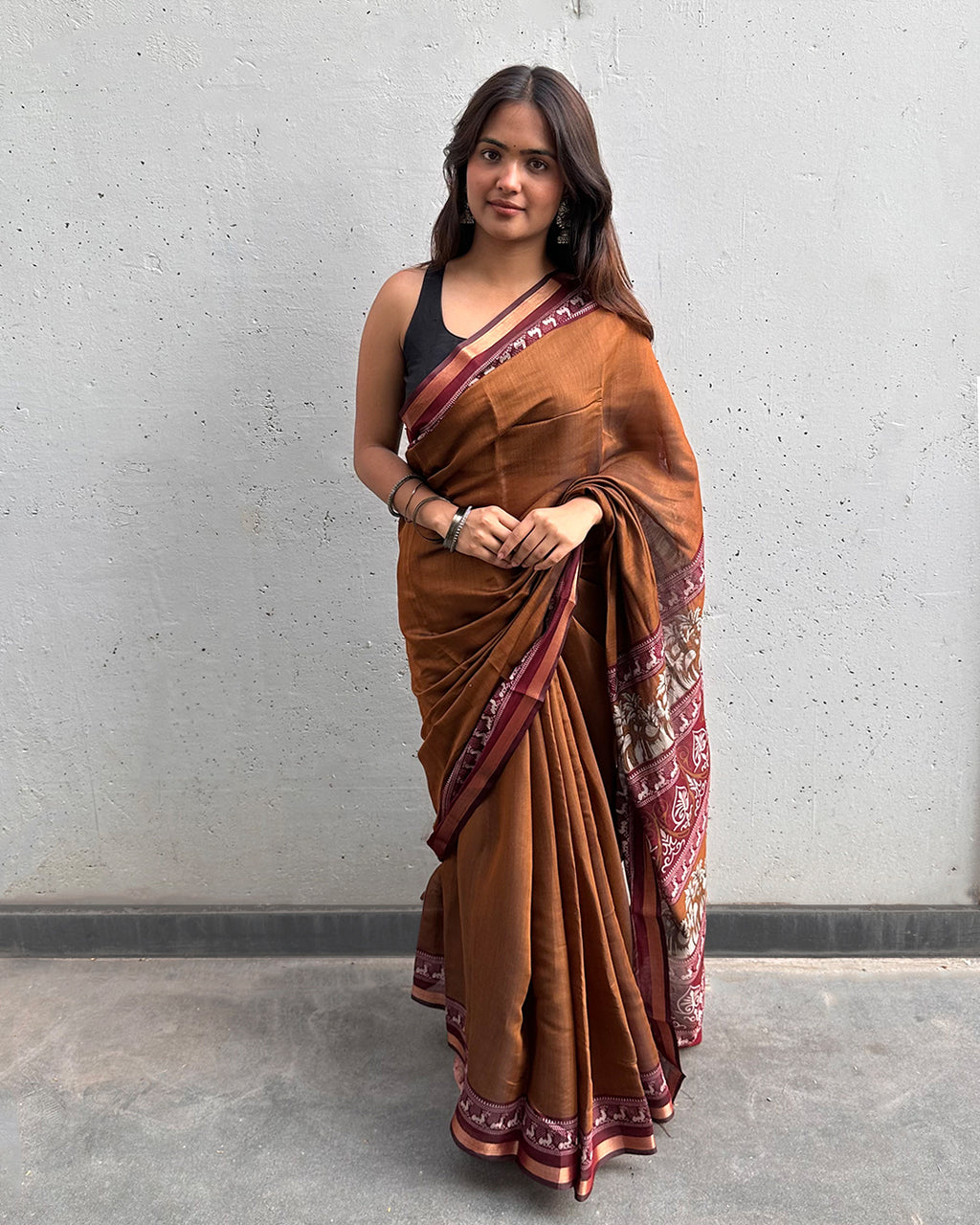 Elegant front drape of the Earthy Brown Cambric Silk Saree by Rajathee Saree with a smooth and lightweight texture.