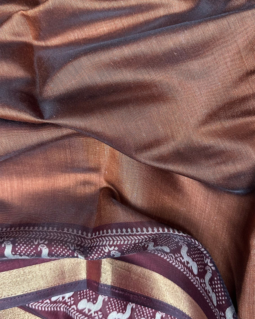 Close-up of the smooth Earthy Brown Cambric Silk fabric showing the subtle sheen and lightweight weave.