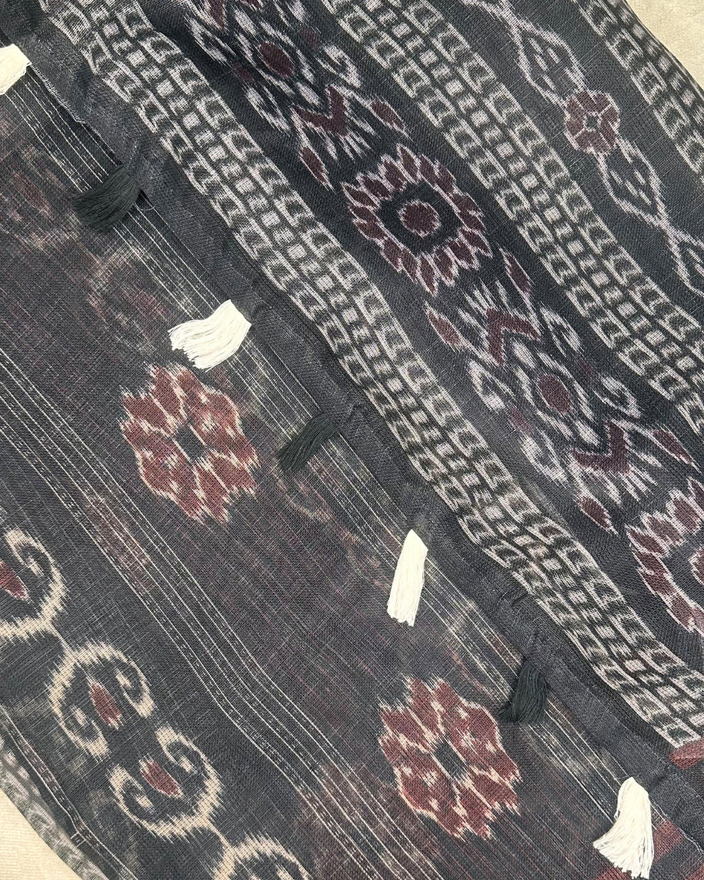 Close-up of the geometric Patola-inspired print on Black Cotton Super Net fabric from Rajathee Saree.