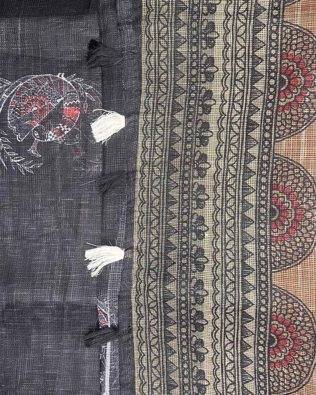 Close-up of the soft Cotton Super Net fabric with traditional peacock print and intricate motifs from Rajathee Saree.