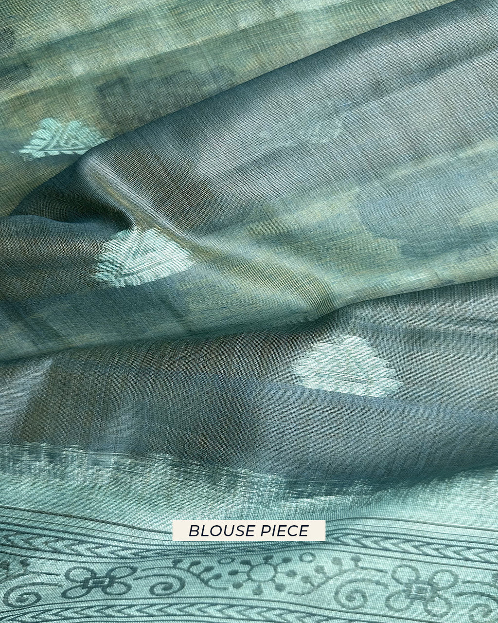 Matching sea green unstitched blouse piece with delicate white geometric motifs for the Rajathee Saree Cotton collection.