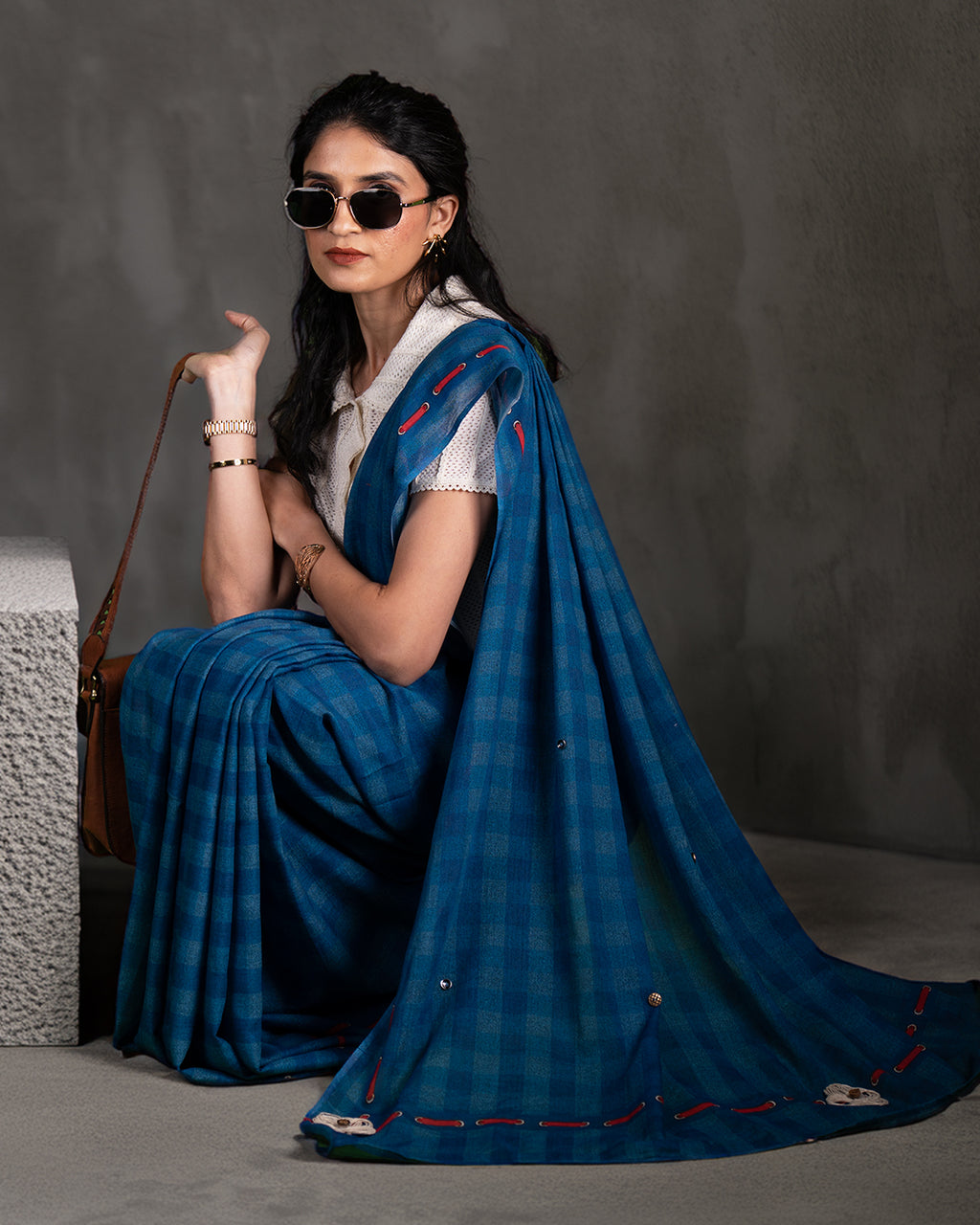Elegant seated view of the Blue Mul Cotton Saree by Rajathee Saree showcasing its soft, breathable, and lightweight drape.