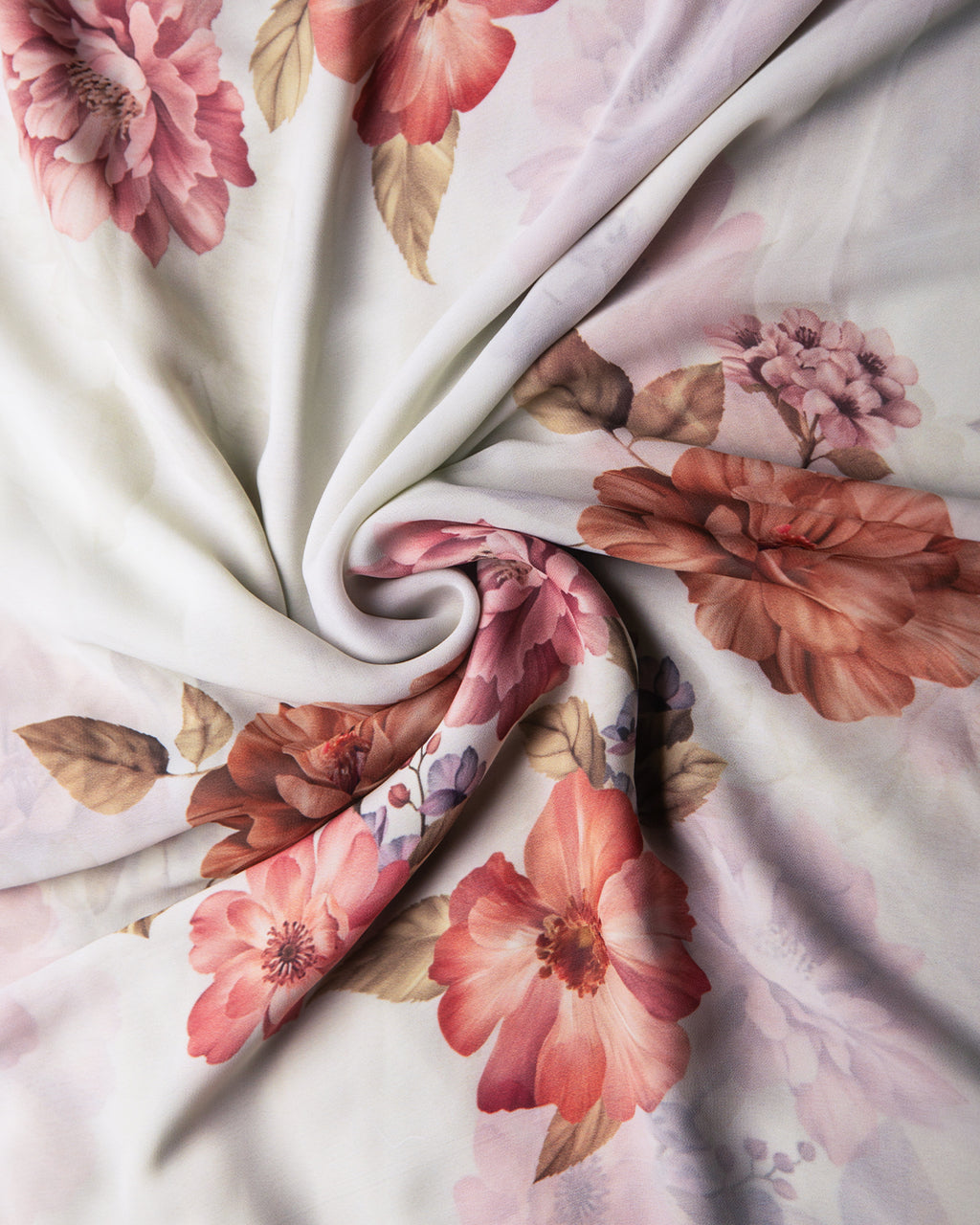 Detailed view of the silky, fluid texture of the Candle Silk fabric featuring a romantic floral narrative print.