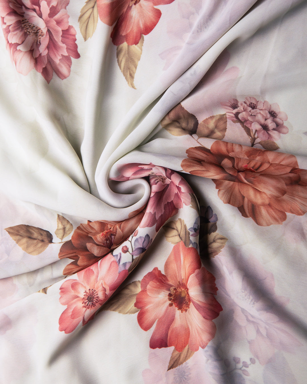 Detailed view of the silky, fluid texture of the Candle Silk fabric featuring a romantic floral narrative print.