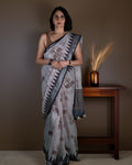 Rajathee Saree Grey Cotton Saree featuring traditional elephant and tree motifs with a geometric border.
