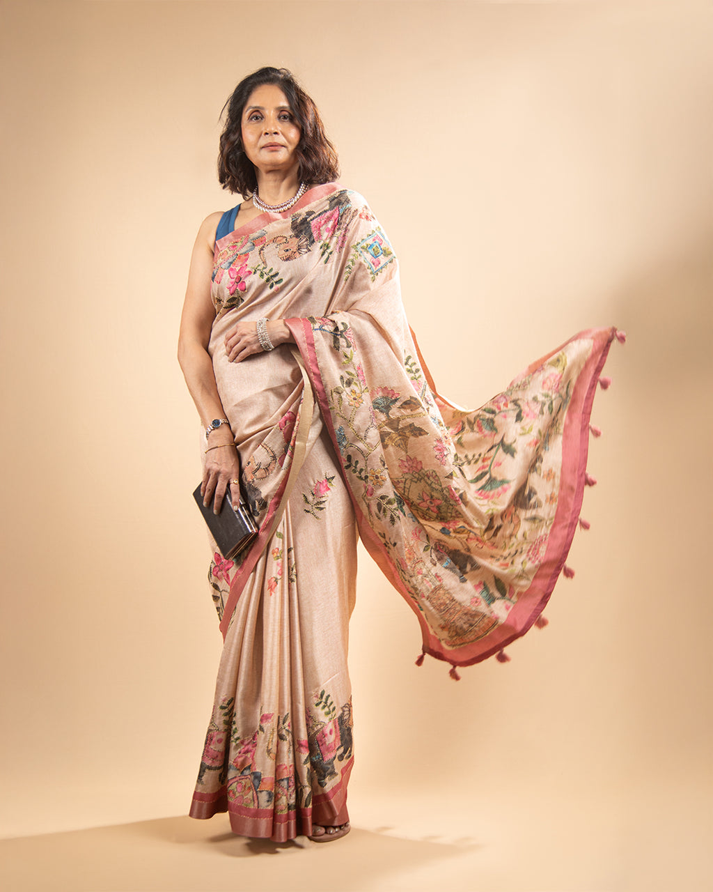 Full standing view of the Blush Pink Cotton Tissue Saree by Rajathee Saree showcasing the detailed botanical narrative pallu.