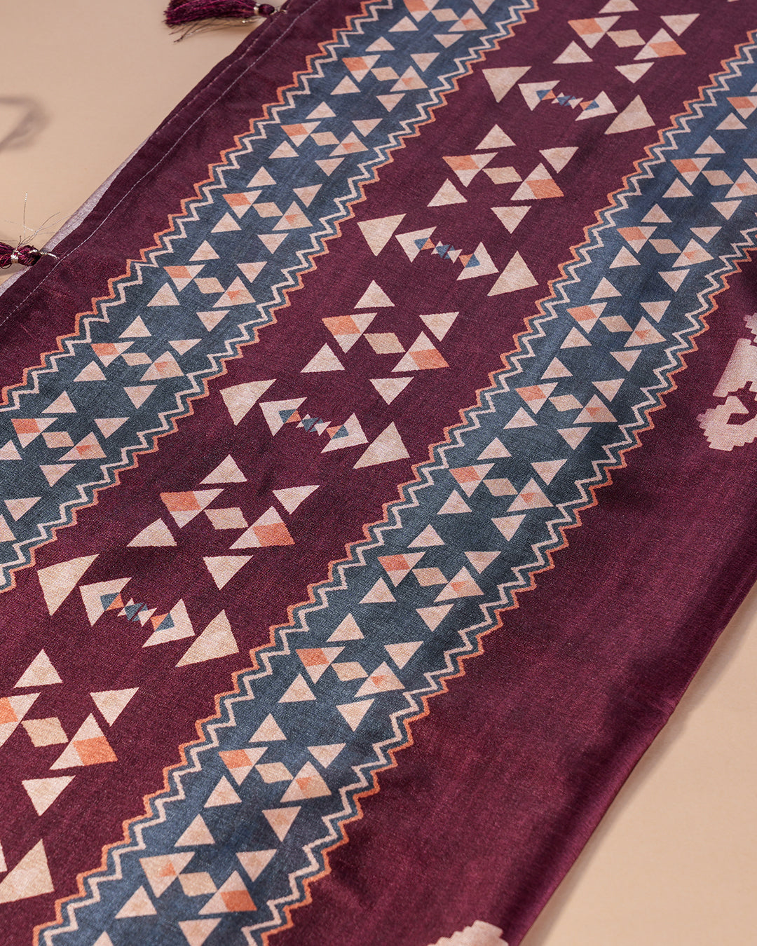 Detailed view of the intricate traditional border and decorated pallu on the Brown Rajathee Saree.