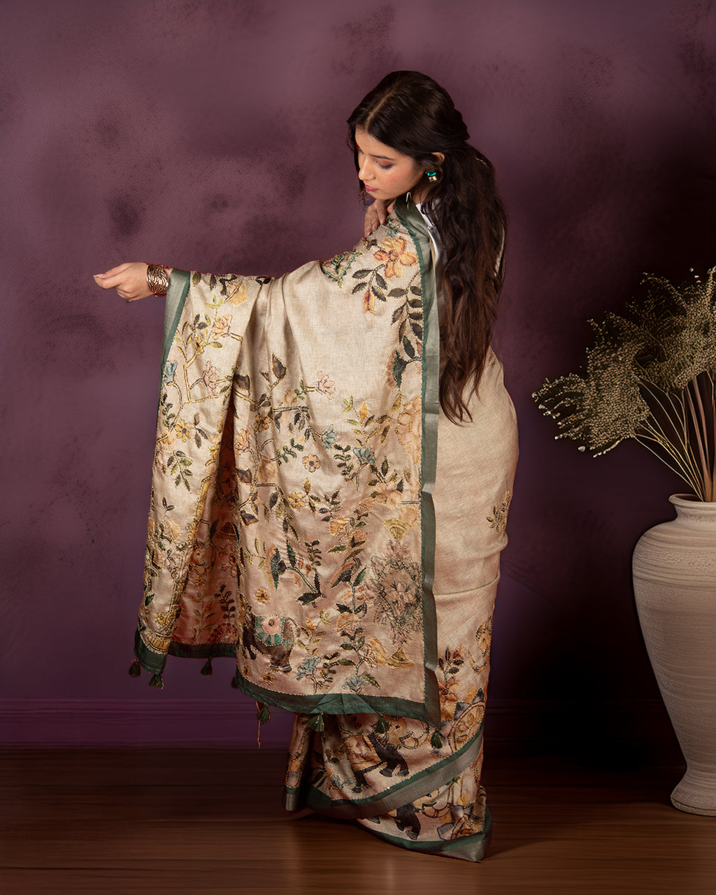Rear view of the Bottle Green Cotton-Tissue Saree showcasing the highly detailed botanical narrative pallu.