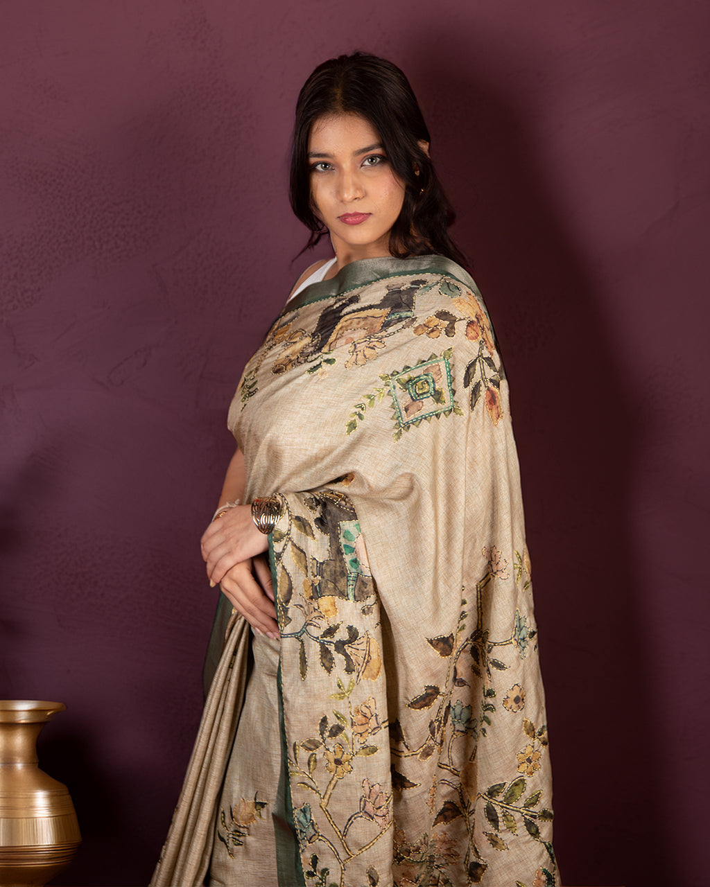 Elegant side profile of the Bottle Green Botanical Narrative Saree by Rajathee Saree highlighting its graceful fall.