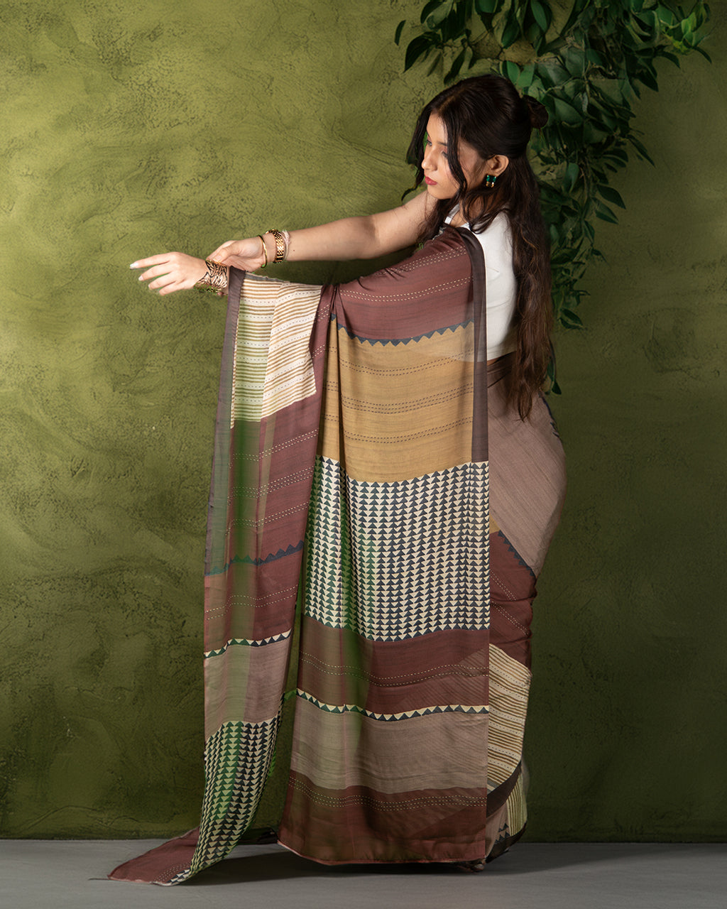 Elegant side profile of the Silk Georgette Saree by Rajathee Saree highlighting its graceful movement and earthy tones.