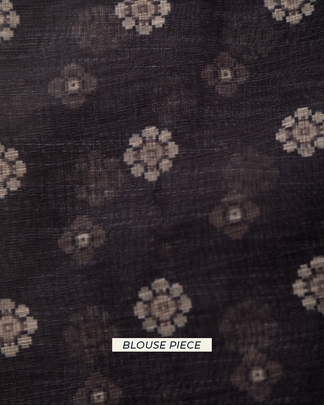 Matching dark grey unstitched blouse piece fabric with delicate floral motifs for the Rajathee Saree collection.