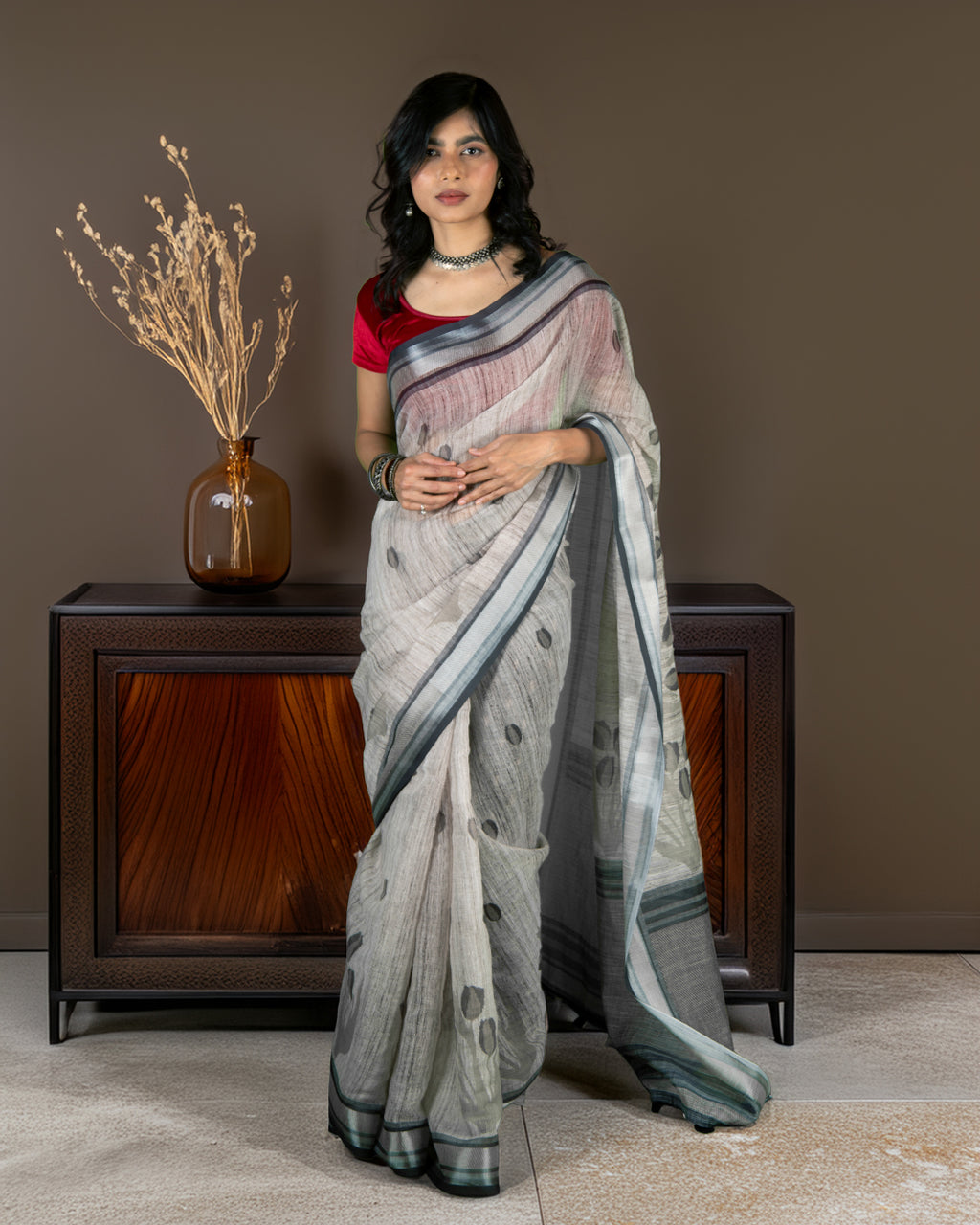 Rajathee Saree Grey Cotton Saree featuring subtle round motifs and a sophisticated striped border.