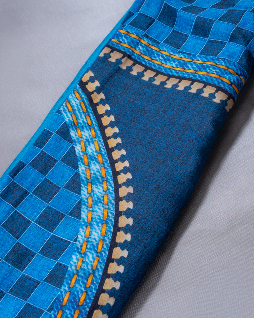 Detailed view of the Sky Blue checkered pallu and intricate geometric border on the Rajathee Saree Mul Cotton.