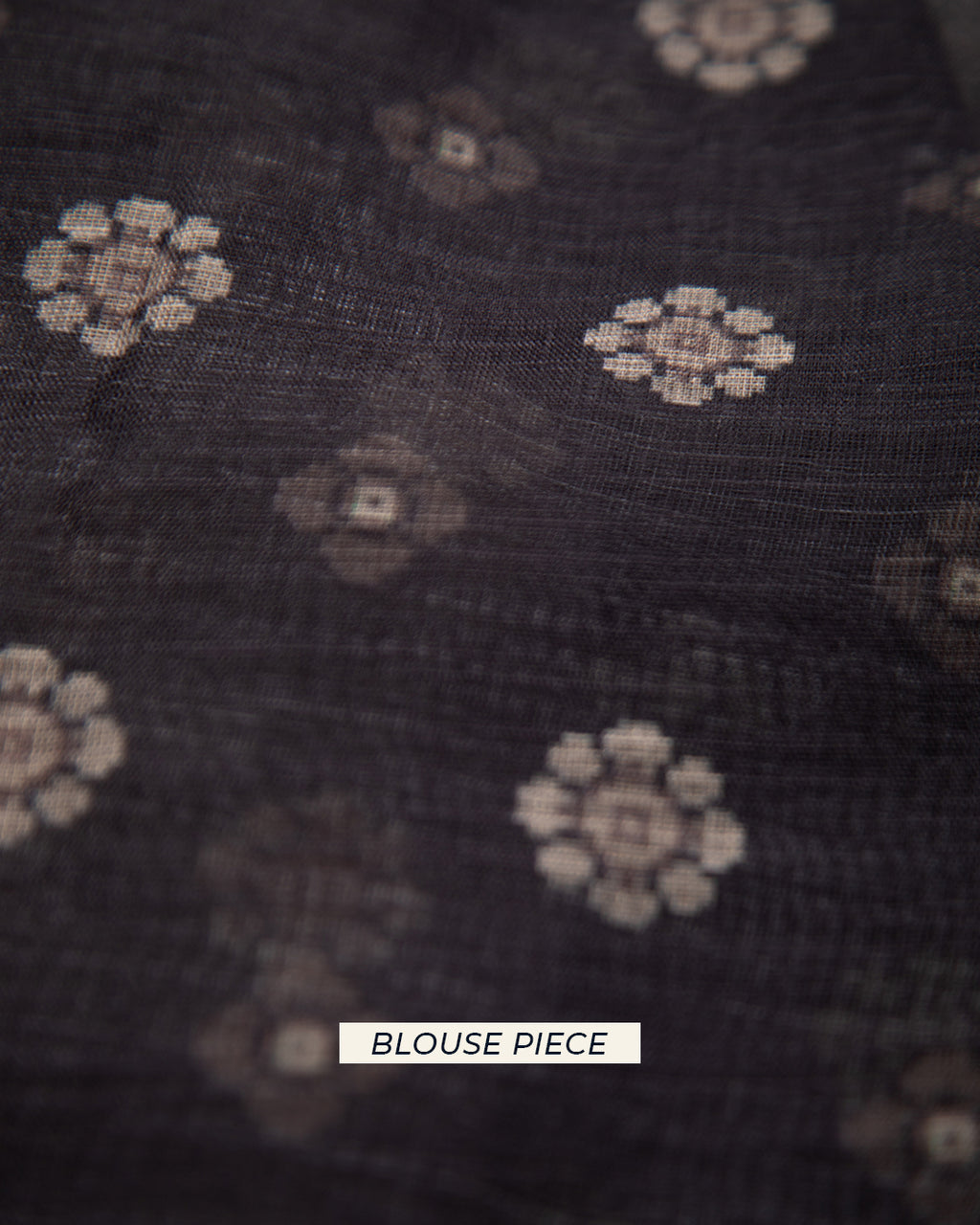 Close-up of the matching charcoal brown cotton blouse piece featuring intricate, small-scale floral motifs.