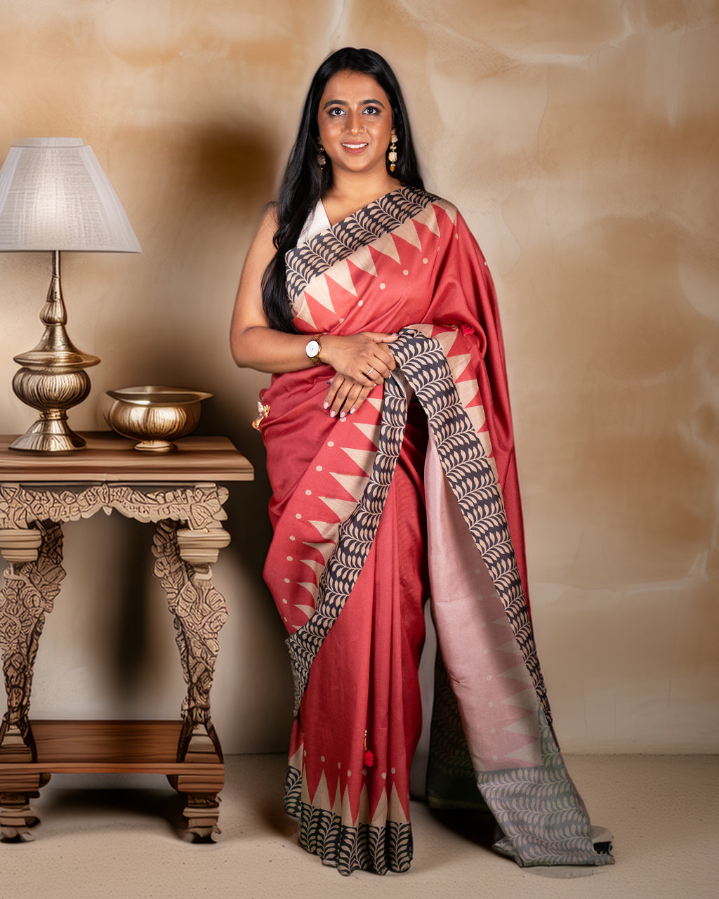 Rajathee Saree Red Raw Silk and Cotton Blend Saree featuring handcrafted floral embellishments and a traditional temple border.