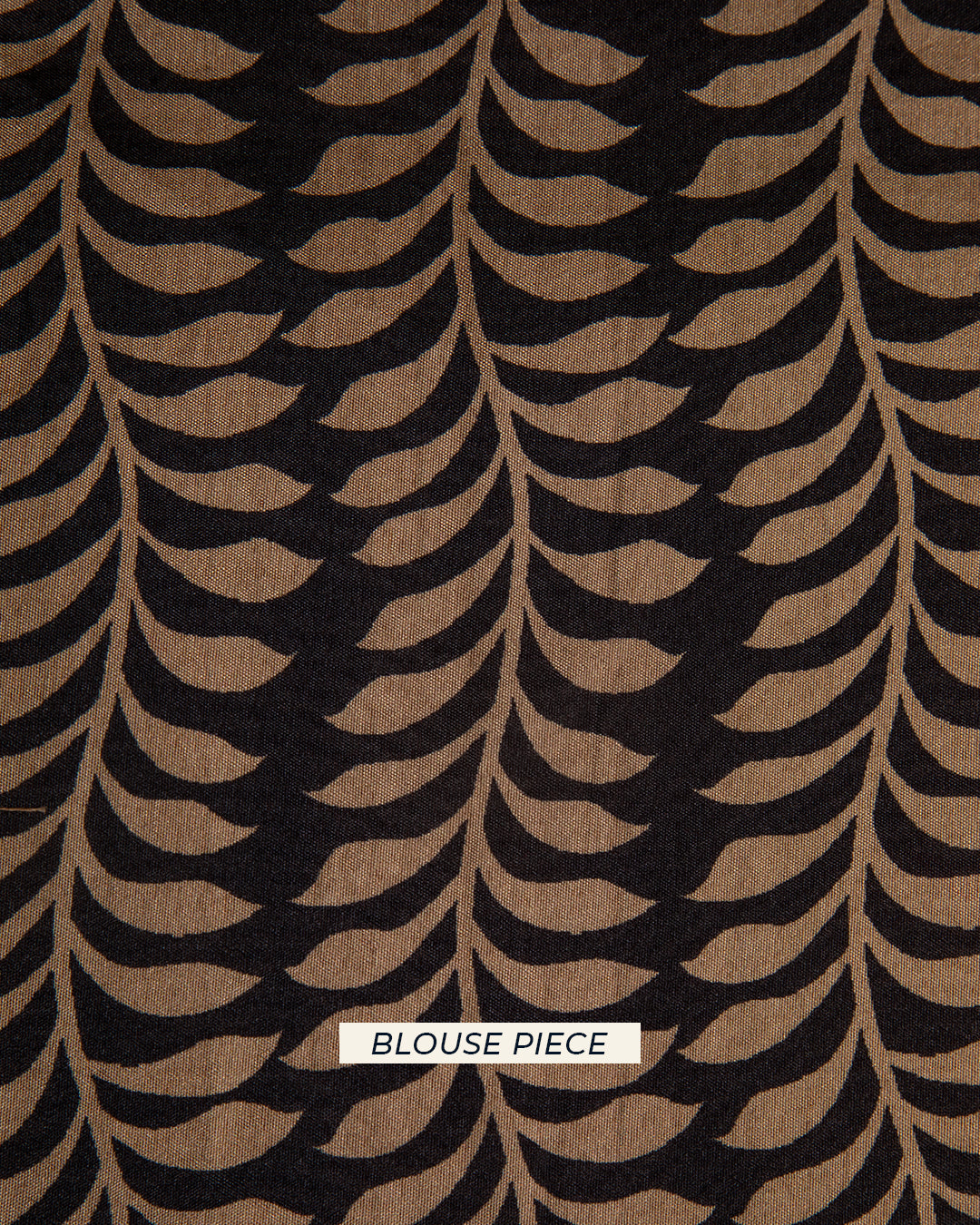 Matching black unstitched blouse piece fabric with a sophisticated leaf-patterned weave for the Rajathee Saree collection.