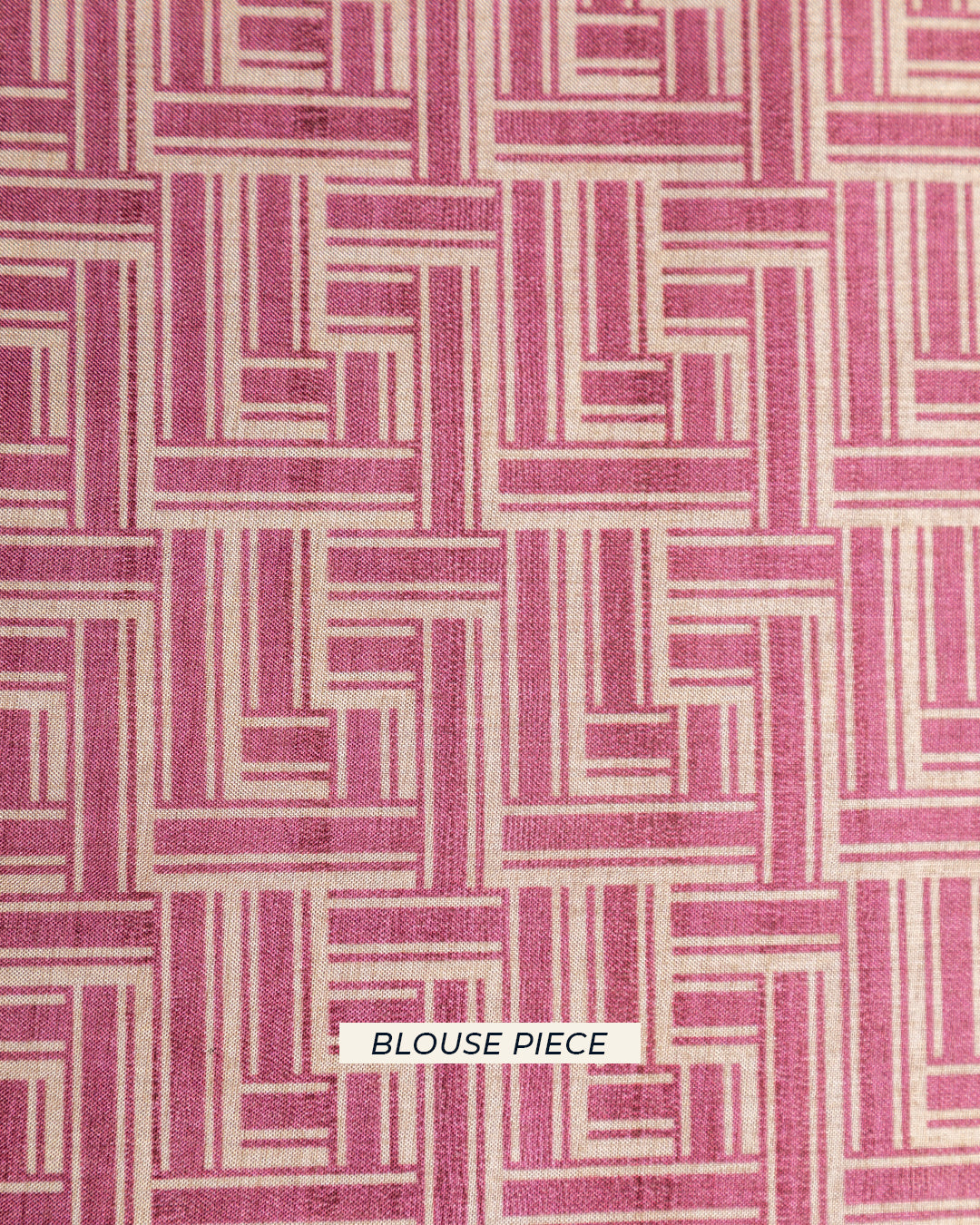 Matching baby pink unstitched blouse piece fabric with a modern interlocking geometric pattern for the Rajathee Saree collection.