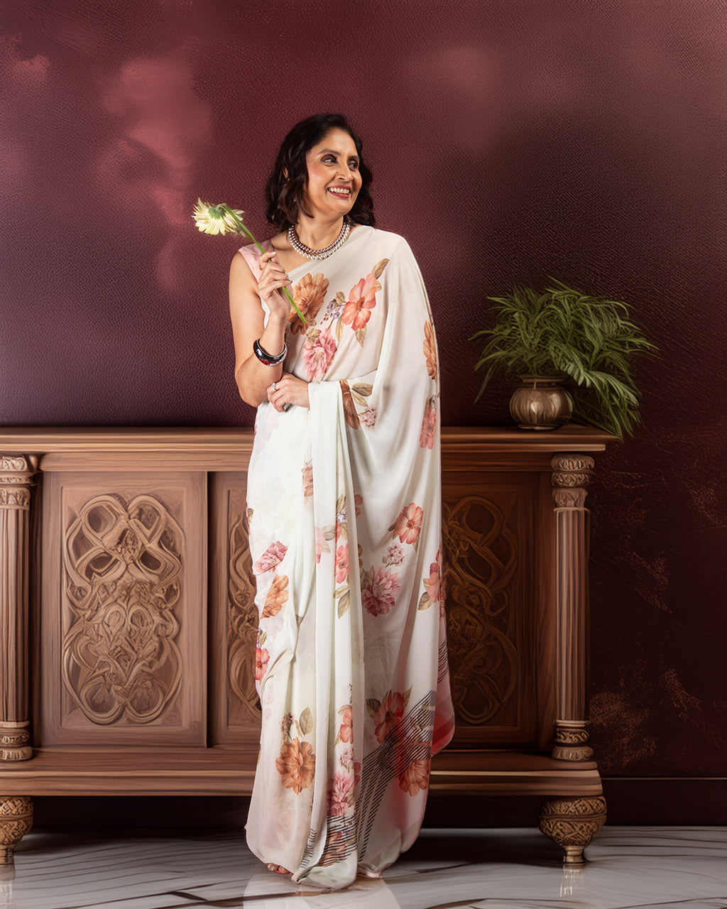Rajathee Saree Off White Candle Silk Saree featuring a delicate peach floral print and a smooth, fluid drape.
