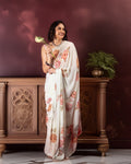 Rajathee Saree Off White Candle Silk Saree featuring a delicate peach floral print and a smooth, fluid drape.