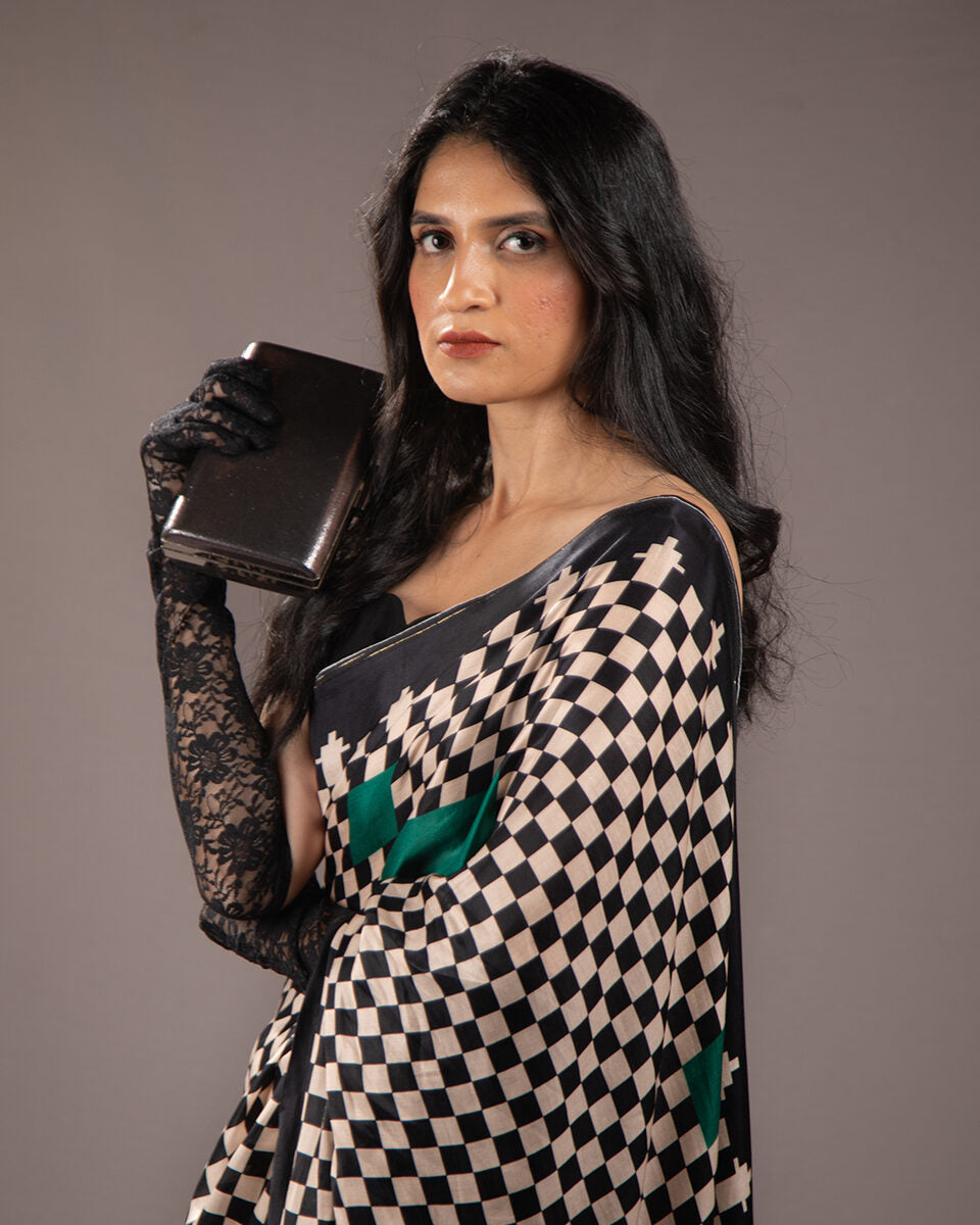 Elegant side profile of the Emerald Green Modal Satin Saree by Rajathee Saree showcasing its glossy, fluid drape.