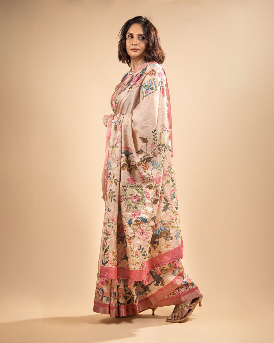 Rajathee Saree Blush Pink Cotton Tissue Saree featuring an intricate botanical narrative print and a soft, graceful sheen.