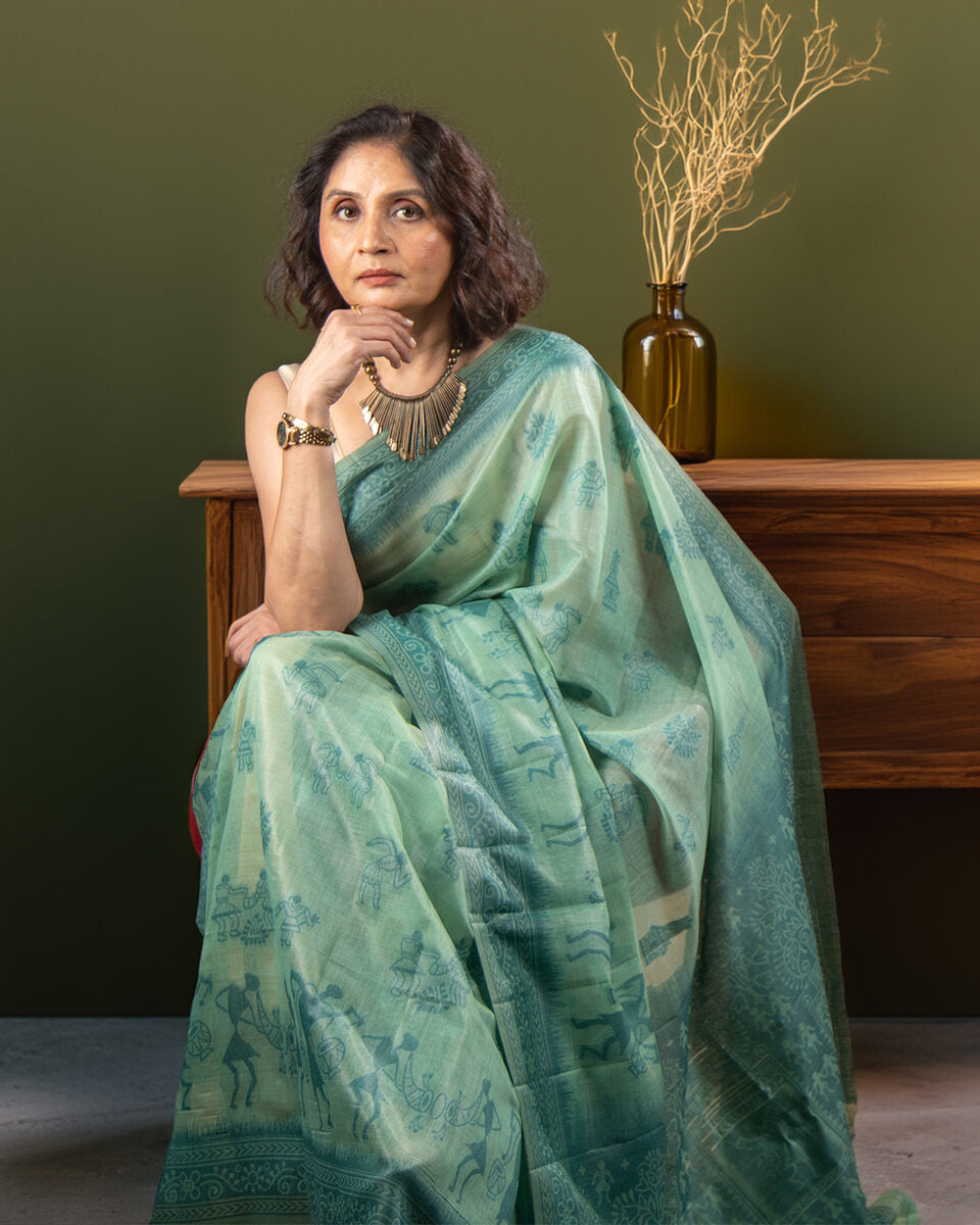 Elegant side profile of the Sea Green Warli Cotton Saree by Rajathee Saree showcasing the traditional print and soft texture.