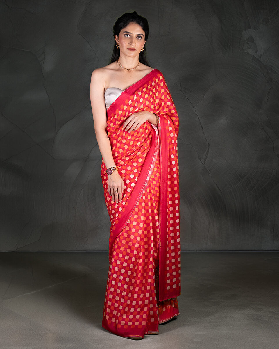 Rajathee Saree Crimson Red Modal Satin Saree featuring a bold checkered geometric grid and a silky glossy drape.