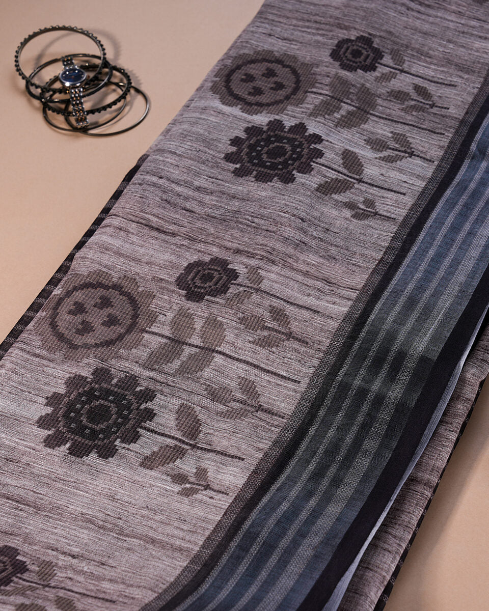 Macro shot of the breathable cotton fabric showcasing the artistic black floral print motifs.