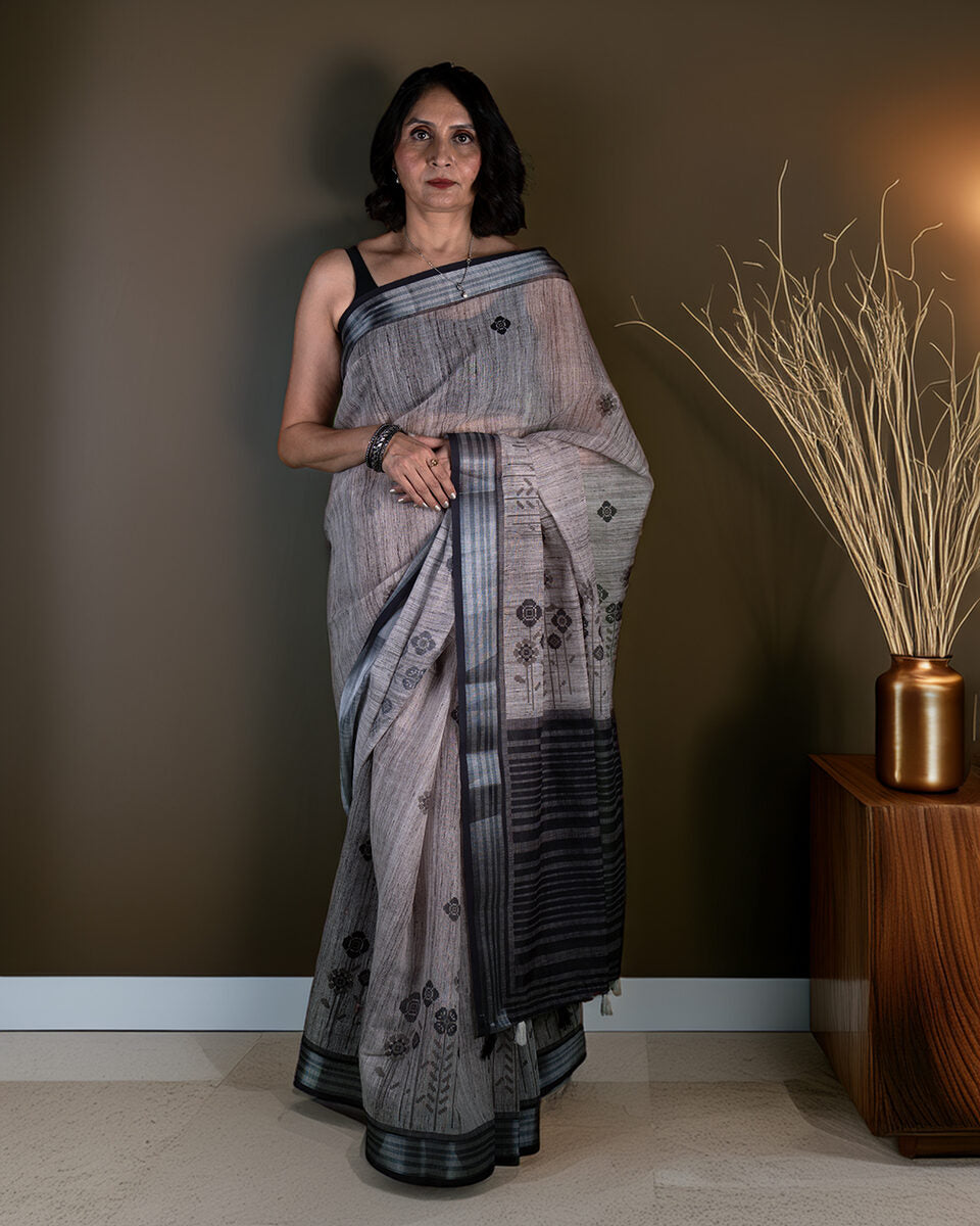 Rajathee Saree Grey Cotton Saree featuring elegant floral-round motifs and a bold striped border.