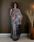 Rajathee Saree Grey Cotton Saree featuring elegant floral-round motifs and a bold striped border.